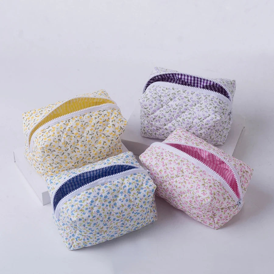 Floral quilted travel makeup bag with zippered closure